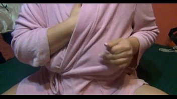 Lactating mom in a pink bathrobe