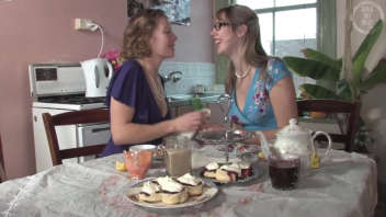 Two lesbian women have fun in the kitchen