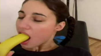 Arab girl using a fruit to satisfy herself