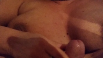 Cumshot on a mature mother's big tits: She is horny and wants her husband's cum on her big tits.