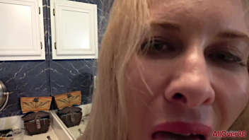 A blonde alone in the bathroom with her sex toy