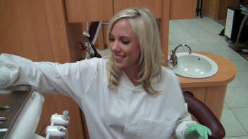 Blonde female dentist warms up patient for fucking