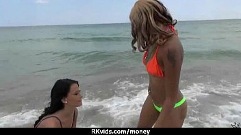 Two naked lesbians pleasure each other for money