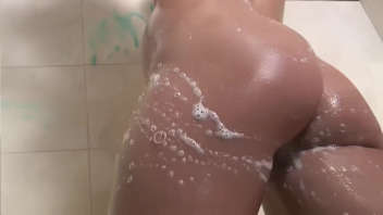 Teen pleasuring herself in the shower