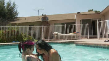 Joanna Angel and Brittany Lynn relax by the pool